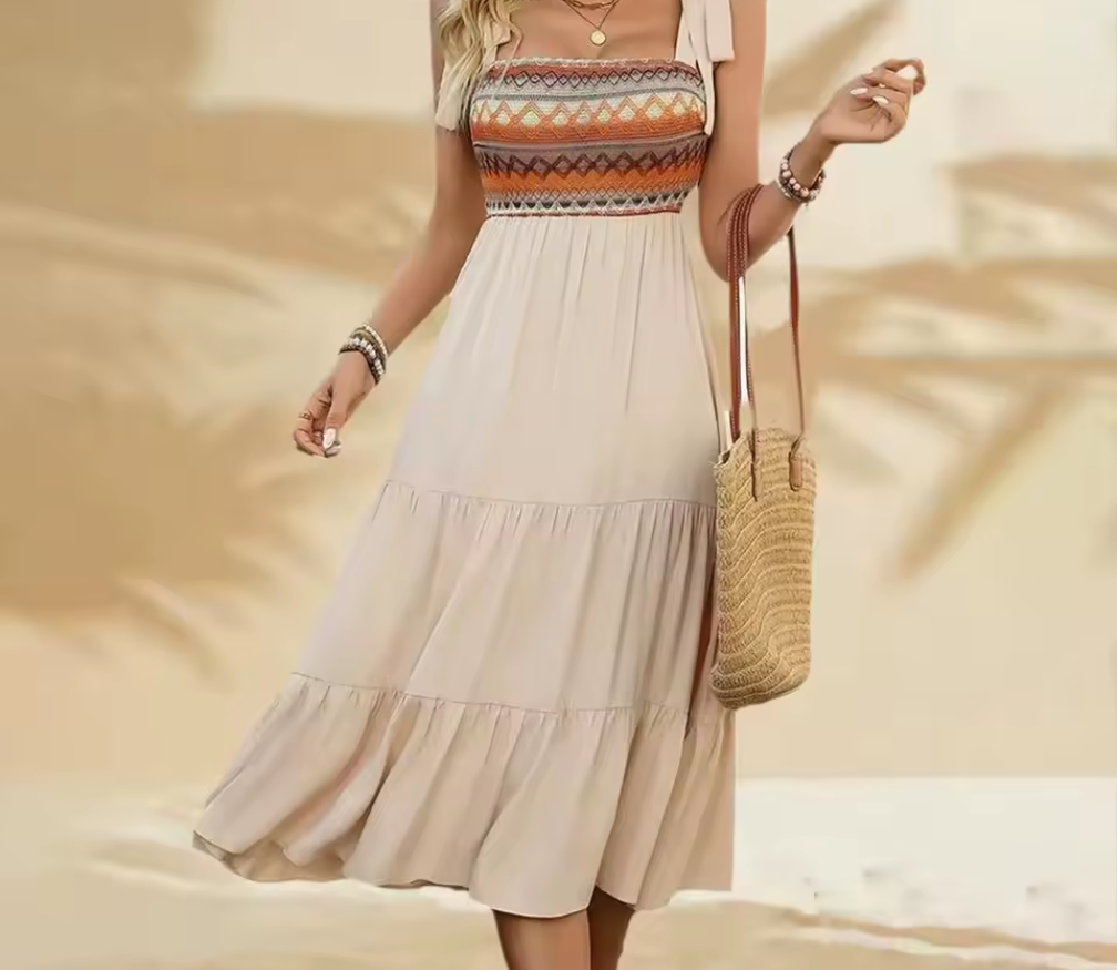 Boho-inspirerad midiklänning med broderat liv och volangkjol