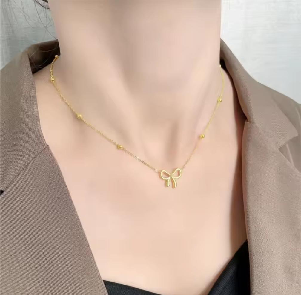 Sweet & Chic – Halsband med rosett i guldton