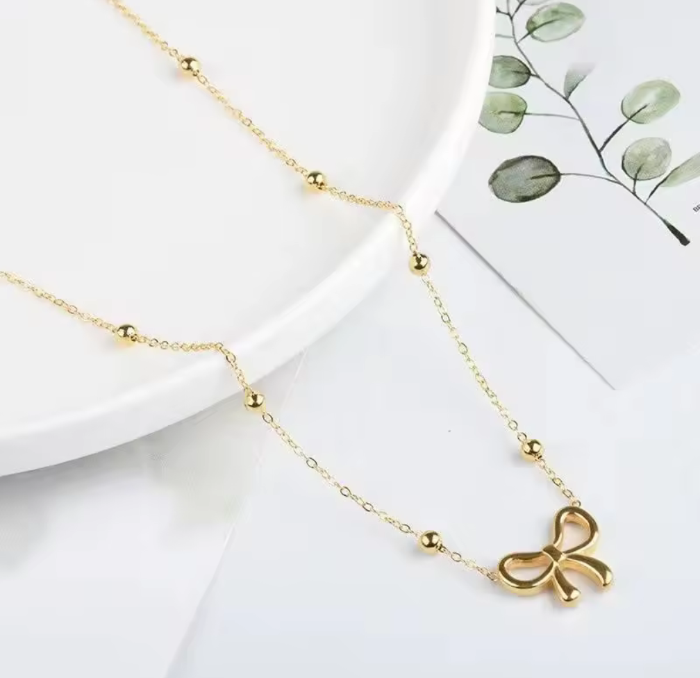 Sweet & Chic – Halsband med rosett i guldton