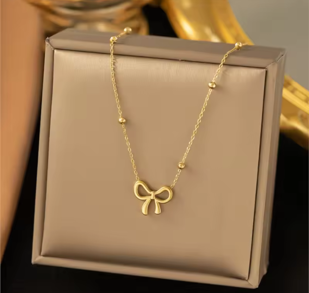 Sweet & Chic – Halsband med rosett i guldton